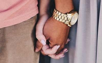 Close up of two women holding hands. Symbolises relationship and health education and RSE