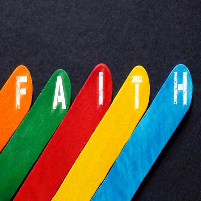 5 colourful lollipop sticks spelling out the word "Faith" representing Understanding RE in Birmingham