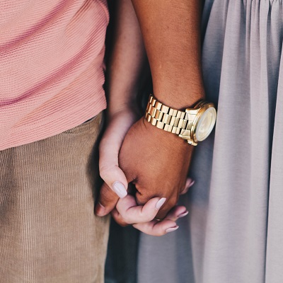 Two people holding hands, symbolising relationship education in primary schools.