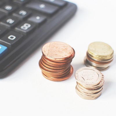 Picture of a calculator and some change