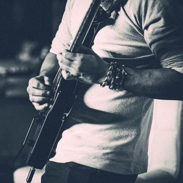 Man playing guitar at a concert